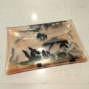 Clear orange glitter bat clutch